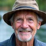 Portrait of David 'Dusty' Rhodes, Angler's Edge co-founder, smiling with a fishing hat.